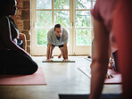 Yoga, class and people at the start of exercise, workout and training on mat for health and wellness. Fitness, gym and man on the floor with pilates, training and stretching body for self care