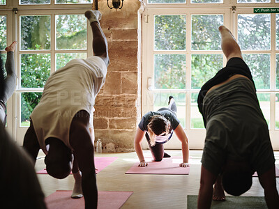 Buy stock photo Stretching, legs and people in yoga class with exercise for fitness, health or body wellness. Group, workout or self care in pilates practice at gym studio for healthcare, mobility or flexibility