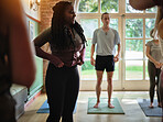 Yoga class, health and young black woman for pilates exercise in a zen studio gym for balance. Fitness, calm and African female person for meditation workout with group for wellness in community hall