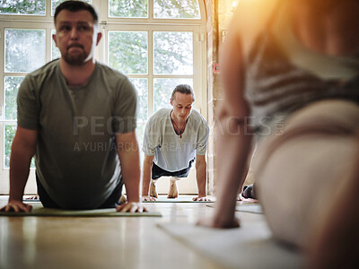 Buy stock photo Yoga class, people and stretching in upward facing dog pose for fitness, wellness or training with studio instructor. Group or man on floor in holistic workout, body and muscle health for flexibility
