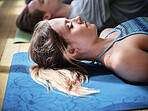 Meditation, yoga and woman in corpse pose at gym, relax and peace in mindfulness. Zen, calm people and savasana body exercise on floor, breathing for fitness and wellness, health and sleep to rest