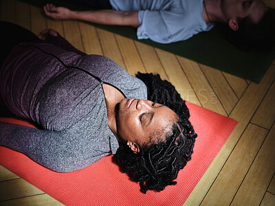 Buy stock photo Yoga, meditation and wellness with a black woman on the floor of a studio for mental health or zen. Relax, peace and balance with a young person on an exercise mat for mindfulness from above