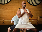 Man, prayer or people learning in yoga class for meditation or body flexibility in zen studio together. Peace, group or calm person in pilates pose for balance, chakra energy or wellness to relax
