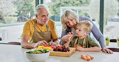 Buy stock photo Eating, grandparents or child cooking for lunch, vegetables or nutrition with love in family home. Fruits, happy grandfather or kid with elderly grandma, health or food for care, teaching or learning
