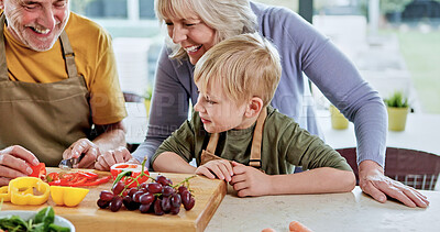Buy stock photo Happy, grandparents or child cooking for lunch, vegetables or nutrition with love in family home. Fruits, senior grandfather or kid with elderly grandma, care or food for diet, teaching or learning