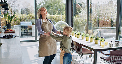 Buy stock photo Happy, dance and grandmother with child in kitchen with celebration, energy and bonding in home. Senior, woman and holding hands with kid for fun, games or laughing together with rhythm, love or care