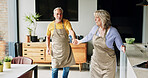 Senior, couple and dancing in living room or happy with bonding, retirement and marriage in apartment. Elderly, man or woman with dance for relationship, apron and romance with smile in house or home