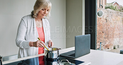 Buy stock photo Cooking, kitchen and mature woman on laptop for online recipe for lunch, supper or dinner in home. Retirement, internet and person on computer with ingredients, vegetables and prepare meal for health