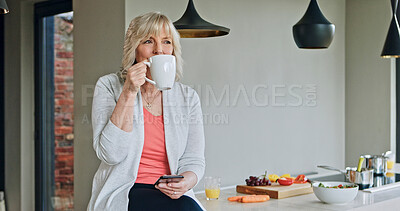 Buy stock photo Woman, drinking coffee and phone or relaxing in kitchen, funny online conversation and social media. Mature person, smartphone and internet connection or mobile app, communication and hot tea at home