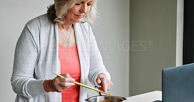 Buy stock photo Laptop, cooking and elderly woman in the kitchen of modern home for healthy or diet supper. Food, technology and senior female person preparing a meal for dinner or lunch with computer at house.