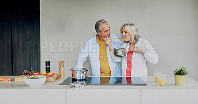 Buy stock photo Tasting, cooking and mature couple in home with support, love and meal prep with healthy food in kitchen. Woman, eating and chef at stove with vegetables, diet or nutrition in dinner or lunch