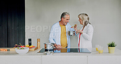 Buy stock photo Cooking, kitchen and senior couple taste food for lunch, supper and meal preparation for bonding. Marriage, retirement and man and woman at home with ingredients, vegetables and healthy dinner