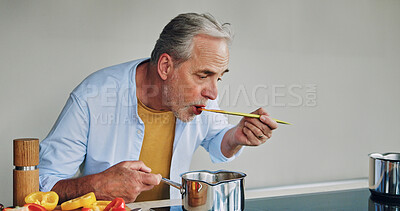 Buy stock photo Mature man, cooking and taste in kitchen with pot, spoon an vegetables for flavor, creativity and nutrition in home. Senior person, eating and test food with thinking, idea or recipe for diet in home