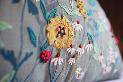 Buy stock photo Home, decor and pillow or closeup upholstery of flowers in apartment or creative stitching, decorations or interior design. Cushion, floral and cozy environment or house, accommodation or hotel room
