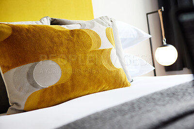 Buy stock photo Bed, pillow and interior of hotel room with hospitality, accommodation and comfort with furniture and decor. Minimalist bedroom, property or house for vacation, getaway or luxury resort with closeup