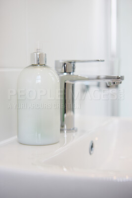 Buy stock photo Bathroom, soap and dispenser at hotel for accommodation with cleaning equipment at resort. Closeup of interior, sink tap or faucet with container, bottle or domestic decor of toiletries at home