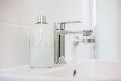 Buy stock photo Bathroom, soap and faucet with dispenser at hotel for accommodation or cleaning equipment at resort. Closeup of interior, sink or tap with container, bottle or domestic decor of toiletries at home