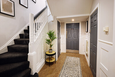 Buy stock photo Indoors, home and stairs with interior design, door and building with real estate and property. Design, furniture and empty room with wood and texture with carpet and plants with steps and house