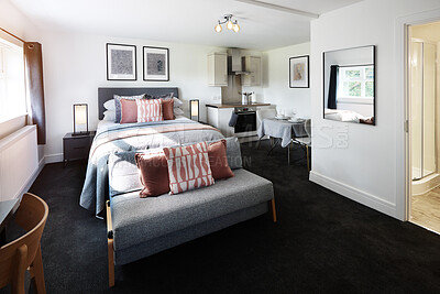 Buy stock photo Hotel, interior and room at luxury accommodation for travel, vacation or holiday in England. Hospitality, bedroom and empty elegant suite with classy furniture and decor for weekend trip at lodge.