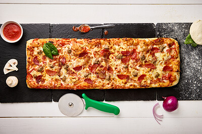 Buy stock photo Top view, fast food and dough of pizza with preparation for dinner, baking process and ingredients on kitchen table. Patisserie, napoli sauce and onion with mushroom in restaurant or cafe from above