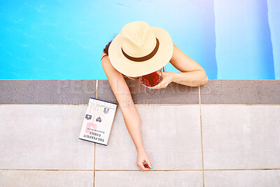Buy stock photo Top view, woman and drink at swimming pool for relax, wellness and freedom for luxury holiday. Water, book and female person at hotel for summer, travel and cocktail for vacation in Hamptons