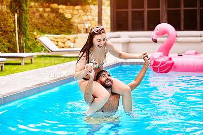 Buy stock photo Smile, man and woman on shoulders in swimming pool outdoor with love, support and bonding in water for romance. Happy, couple and piggyback for trust, care and airplane game of freedom on holiday

