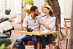 Happy couple, hug and cafe with date for travel, sightseeing or outdoor bonding together. Young man, woman or tourists enjoying romantic getaway, reservation or holiday trip outside coffee shop