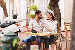 Happy couple, hug and outdoor cafe with date for travel, sightseeing or bonding together. Young man, woman or tourists enjoying romantic getaway, reservation or holiday trip outside coffee shop