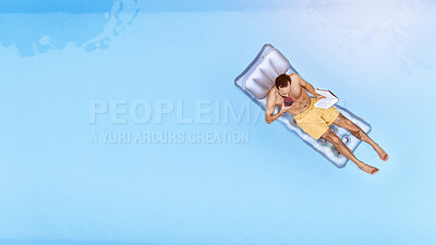 Buy stock photo Relax, drink and man on inflatable in swimming pool for summer vacation, weekend break or getaway at resort. Aerial view, safety and person with book on float for sunbathing, comfortable or holiday