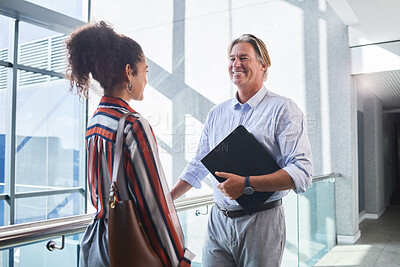 Buy stock photo Collaboration, meeting and planning with business people in office for administration or conversation. Accounting, audit and file with mature man talking to woman employee in professional workplace