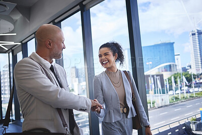 Buy stock photo Business people, handshake and welcome in office with introduction for partnership, greeting or collaboration. Walking, teamwork and lawyer man with woman shaking hands for deal, trust or agreement