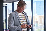 Phone, communication and mature businessman in airport on mobile app for flight check in on work trip. Cellphone, travel and finance executive booking hotel accommodation online for corporate journey