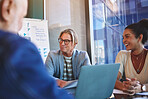 Business, people and laptop for meeting in office with paperwork for feedback or review of company sales. Employee, documents and discussion in workshop with support of ideas on project growth


