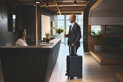 Buy stock photo Service, reception and mature man with suitcase in hotel for business meeting, hospitality or check in. Travel, concierge woman and person with luggage for welcome, vacation or sales convention