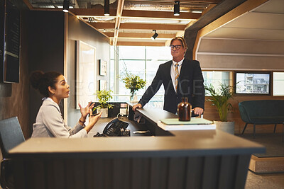 Buy stock photo Businessman, reservation and receptionist in hotel, talking and travel for meeting, desk and networking. Check in, hospitality and professional person in resort, registration and communication