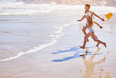 Buy stock photo Kids, beach or running with bucket for playing in water with fun activity, summer holiday or race game. Children, siblings or swimwear on sand with tropical adventure, family vacation or plastic toys