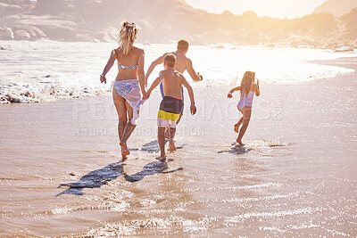 Buy stock photo Parents, children and running at beach, waves and vacation with love, summer and back in nature. Father, mother and kids with connection, holiday and sunset with playful family by ocean in Spain