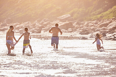 Buy stock photo Water, kids and parents running on beach for fun, travel holiday or bonding together on tropical adventure. Waves, energy and family playing on island vacation with ocean, splash and summer from back