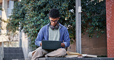 Buy stock photo Student, man and typing with laptop outdoor for university project, research and information of education. Smile, male person and glasses with digital for online learning, exam results and studying