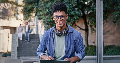 Buy stock photo Portrait, student and typing with laptop outdoor for university project, research and information of education. Smile, male person and glasses for digital online learning, exam report and studying