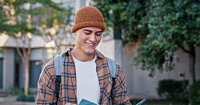 Buy stock photo University, student and man reading outdoor on campus with book for education, learning and scholarship. Gen z, person and happy at college for studying, knowledge and backpack for research in USA