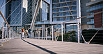 City, people and bridge with buildings, sunshine and walking with break, start day and tourism. Urban town, New York and outdoor with group, fresh air and morning with architecture and engineering
