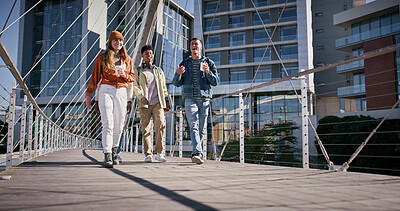 Buy stock photo City, students and friends walking on bridge in city together with smile, coffee and conversation. University, scholarship and happy group of friends chat on morning commute to urban college campus