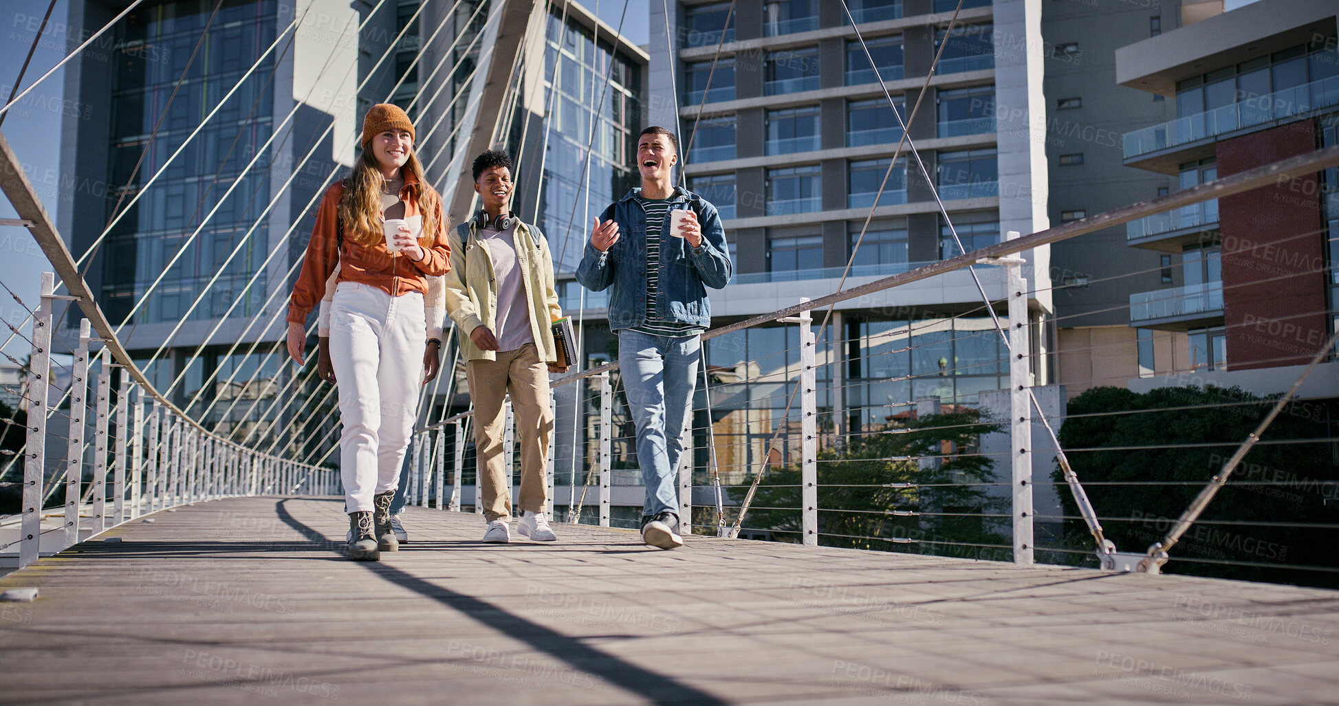 Buy stock photo City, students and friends walking on bridge in city together with smile, coffee and conversation. University, scholarship and happy group of friends chat on morning commute to urban college campus