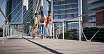 City, students and friends walking on bridge in city together with smile, solidarity and conversation. Urban, university and happy group of friends chat on morning commute to college campus from back