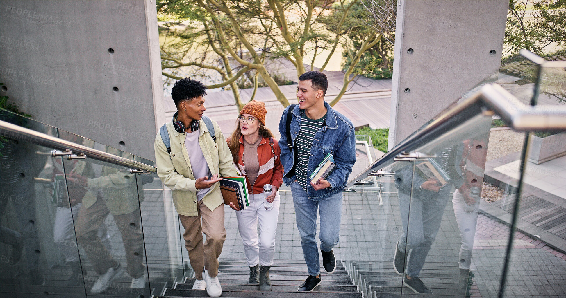 Buy stock photo Development, education and walking with friends on stairs at college or university campus for learning. Conversation, growth or study with man and woman students outdoor at school together for future