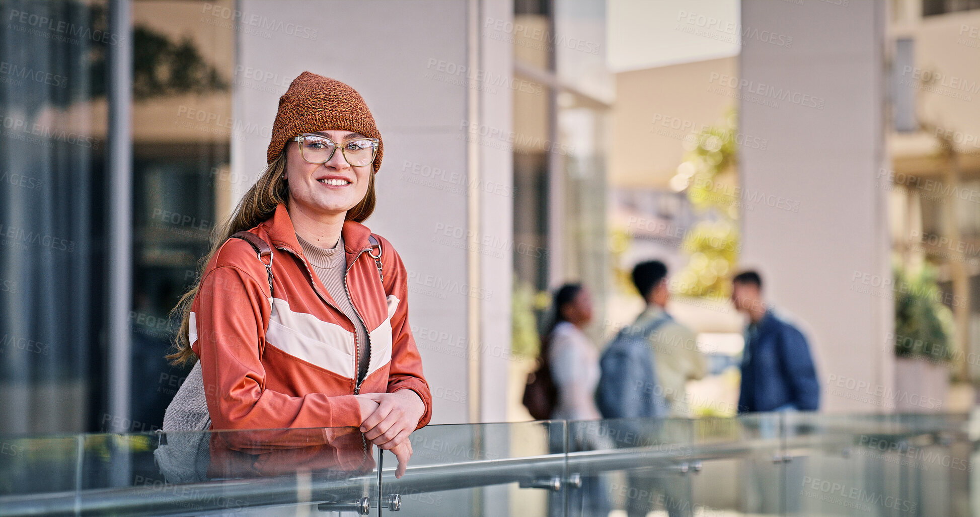 Buy stock photo Woman, university student and happy in balcony with pride for education, progress and study in England. Female person, college learner and smile on portrait with confidence for exams and assessment