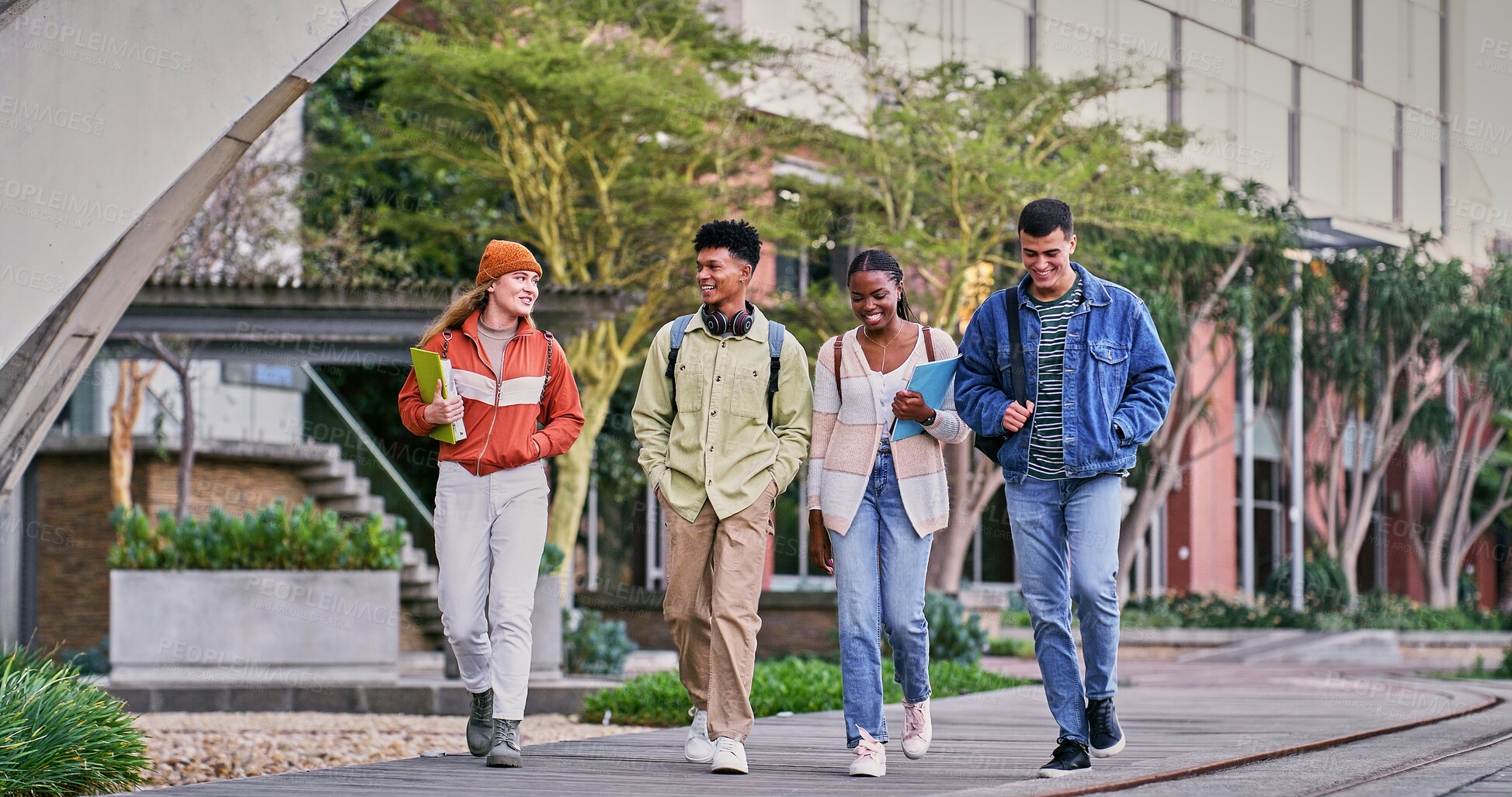 Buy stock photo Group, students and walking with friends, smile and backpacks for outdoor on campus or university. People, happy and talking for education, development and scholarship for learning, college or school