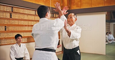 Buy stock photo Man, karate and student in class for sport, safety training and start fight for self defense. Mature sensei, Japanese people and martial arts in dojo for learning heritage, lesson and discipline