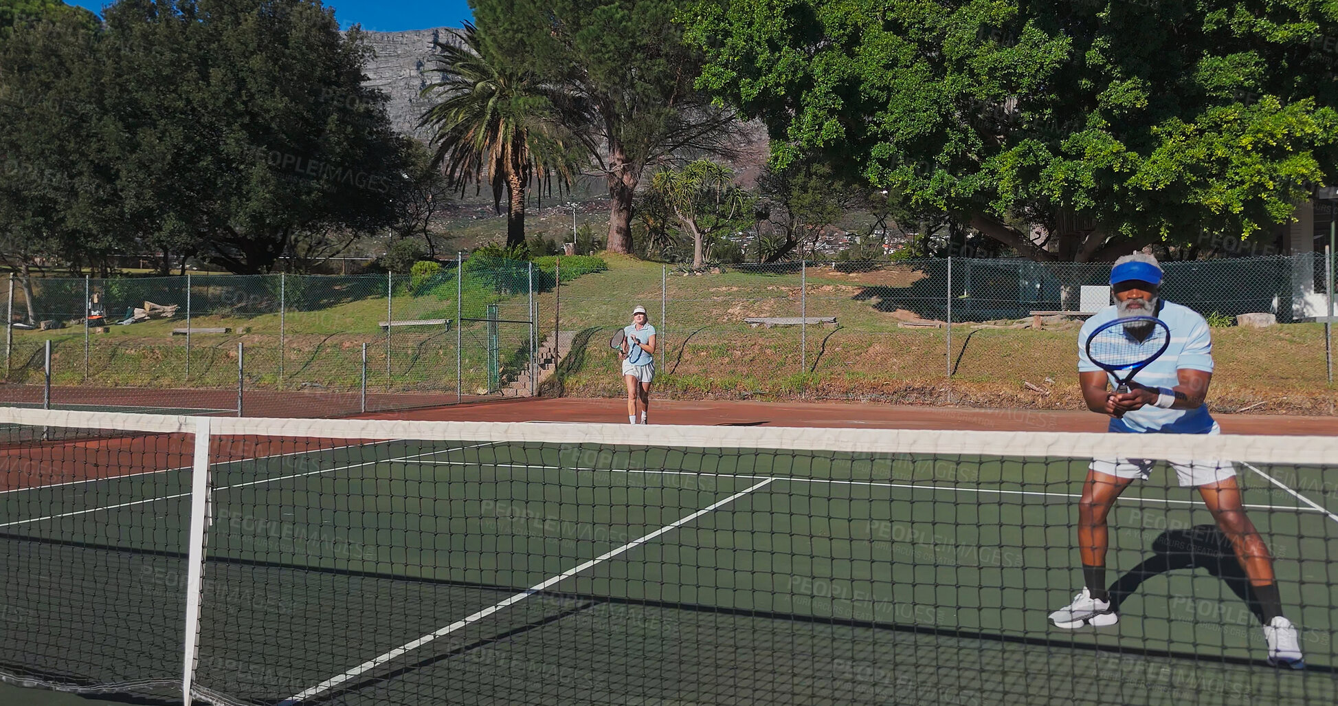 Buy stock photo Tennis, healthy and mature people with racket, performance and playing of game for fitness, exercise and active. Outdoor, training and athlete with equipment for workout, sport or confident for match